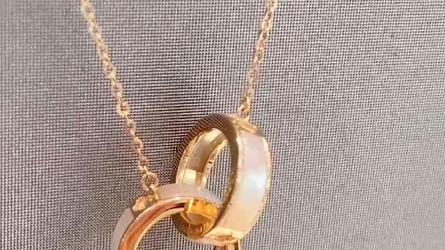 The two rings are combined into a necklace