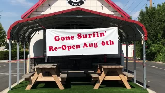 Gone surfing sign at pizzeria