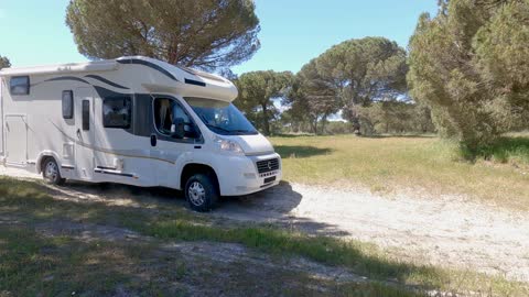 An RV Driving in the Outdoors