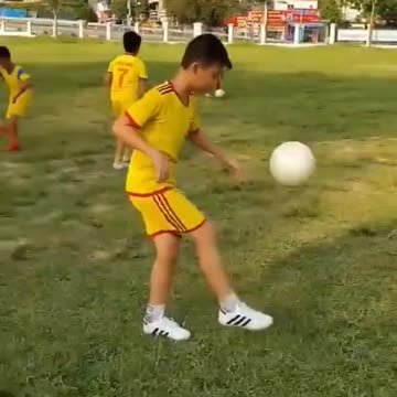 Little Boy Showing Talent As First Steps Brushing Up On Football