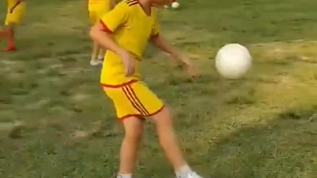 Little Boy Showing Talent As First Steps Brushing Up On Football