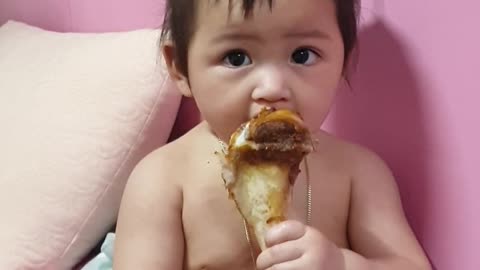 My 8-month-old baby is eating pork feet.