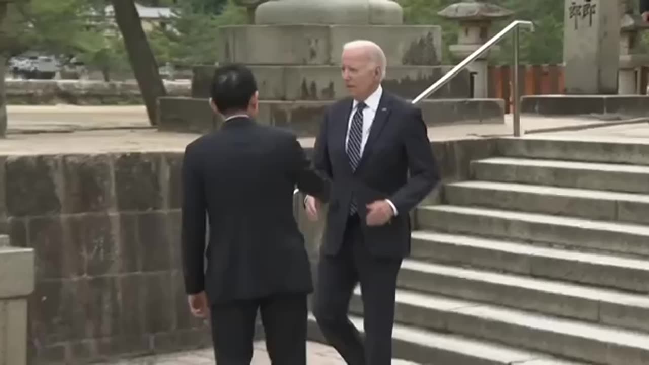 Biden, 80, stumbles while walking down steps of shrine as G7