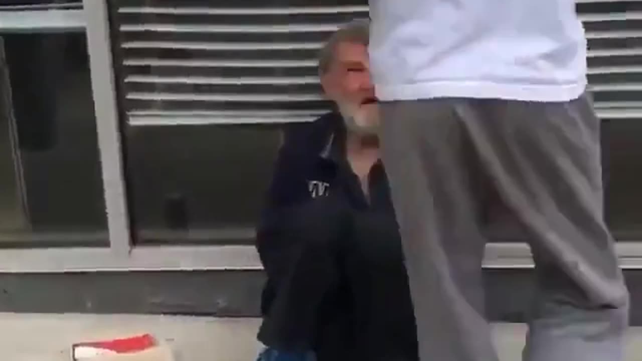 Black man pretends to set fire to a homeless white man while his friend films the incident