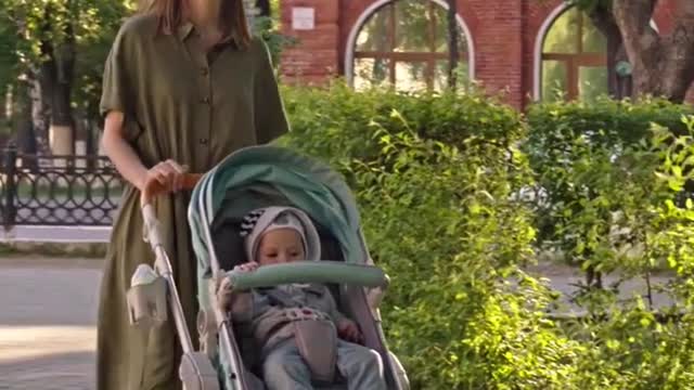 Baby with mom in garden