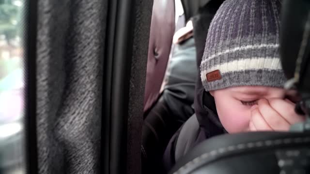 'We left our Dad in Kyiv' -little boy chokes back tears