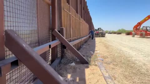 Biden now frantically shoring up the border fence with Trump era fencing materials.