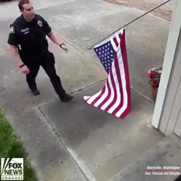 Washington State Cop Rolling Up American Flag