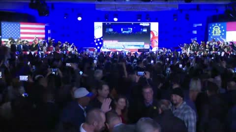 Crowd at Warnock watch party goes into frenzy reacting to news he was reelected for Senate