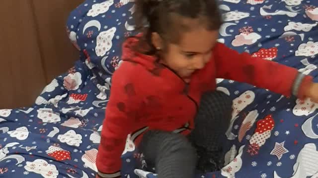 little girl tumbling and laughing