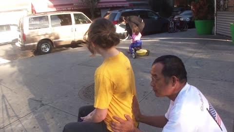 Luodong Massages Cute White Girl On Sidewalk