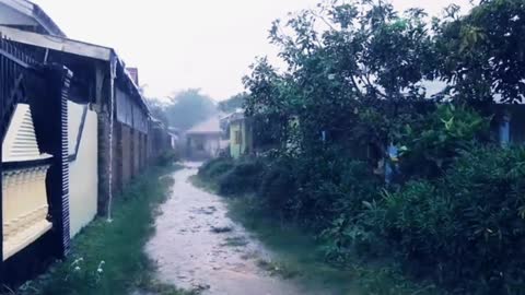 Walking in heavy rain Indonesian rural