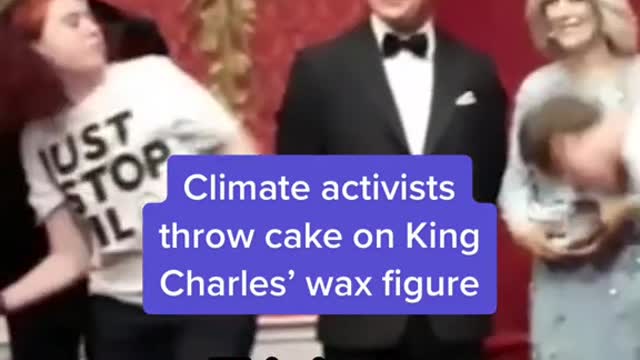 Climate activists throw cake on King Charles' wax figure