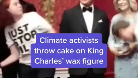 Climate activists throw cake on King Charles' wax figure