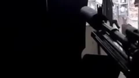 A fighter from the front line shows the progress of work