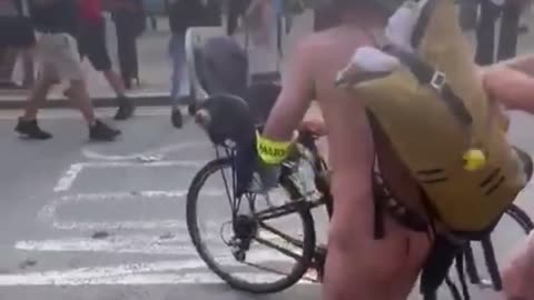 Travellers dealing with the "naked bike ride"