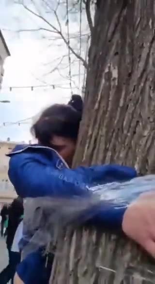 Ukrainian police restrained a girl to a tree, accusing her of theft and branding her as a "thief."