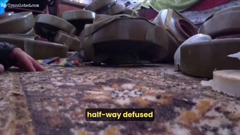 Ukrainian soldier demonstrates defusing a grenade