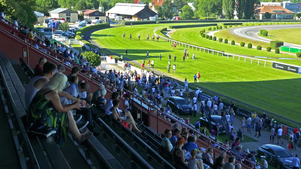 racecourse - riders on horses - after race - audience (people)