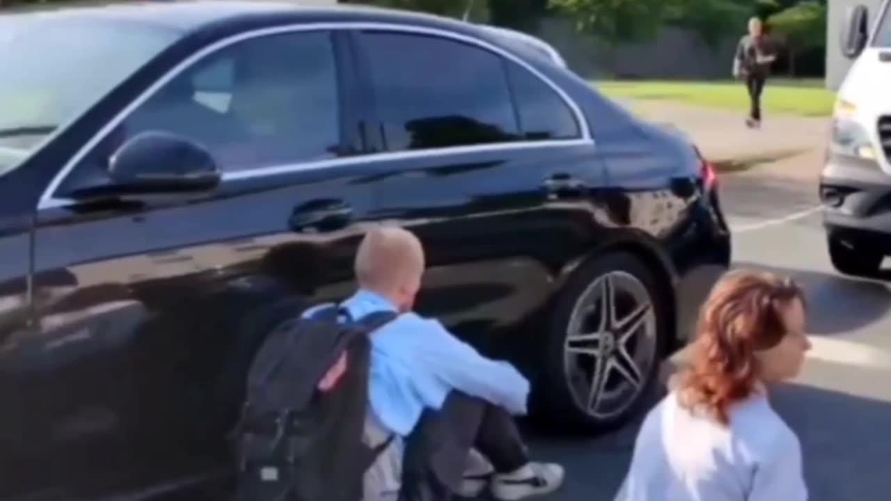 Protestor involuntarily kisses the bumper
