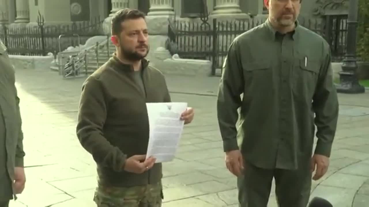 Zelensky signs Ukraine's expedited application to join NATO.