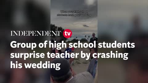 Group of high school students surprise teacher by crashing his wedding