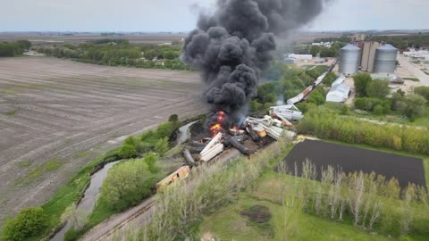 Bird's Eye View Of Black Clouds Engulfing Sky As Derailed Train Catches Fire In Iowa, USA