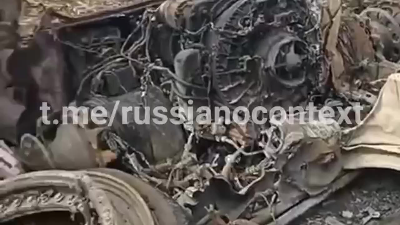 Russian Soldiers Examine What's Left of Their T80 Tank with Bewilderment