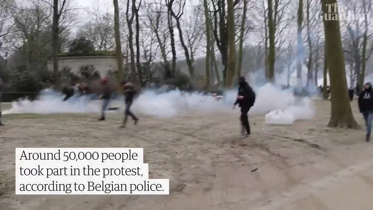 Police use water cannon at Brussels protest against Covid rules