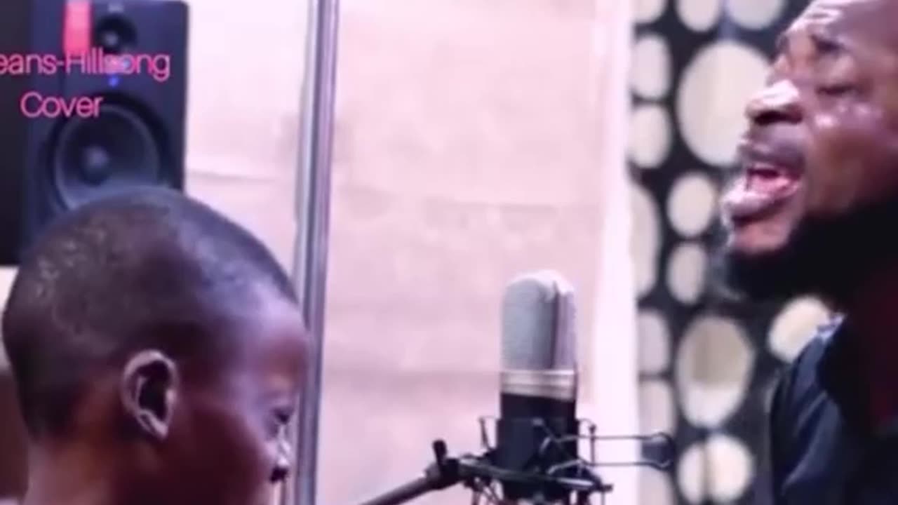 Father and son sing together