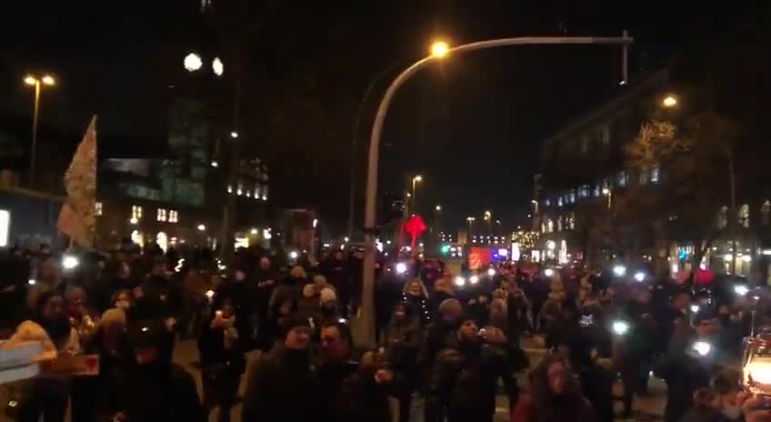 Hamburg Germany - last night lights up the streets as citizens gather together to protest for Freedom