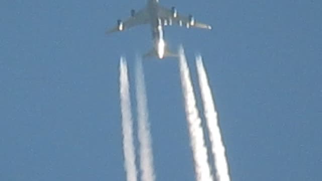 Close up of plane spraying whatever it is they spray