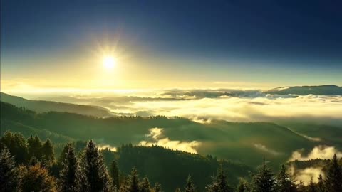 The sun rises above the clouds.