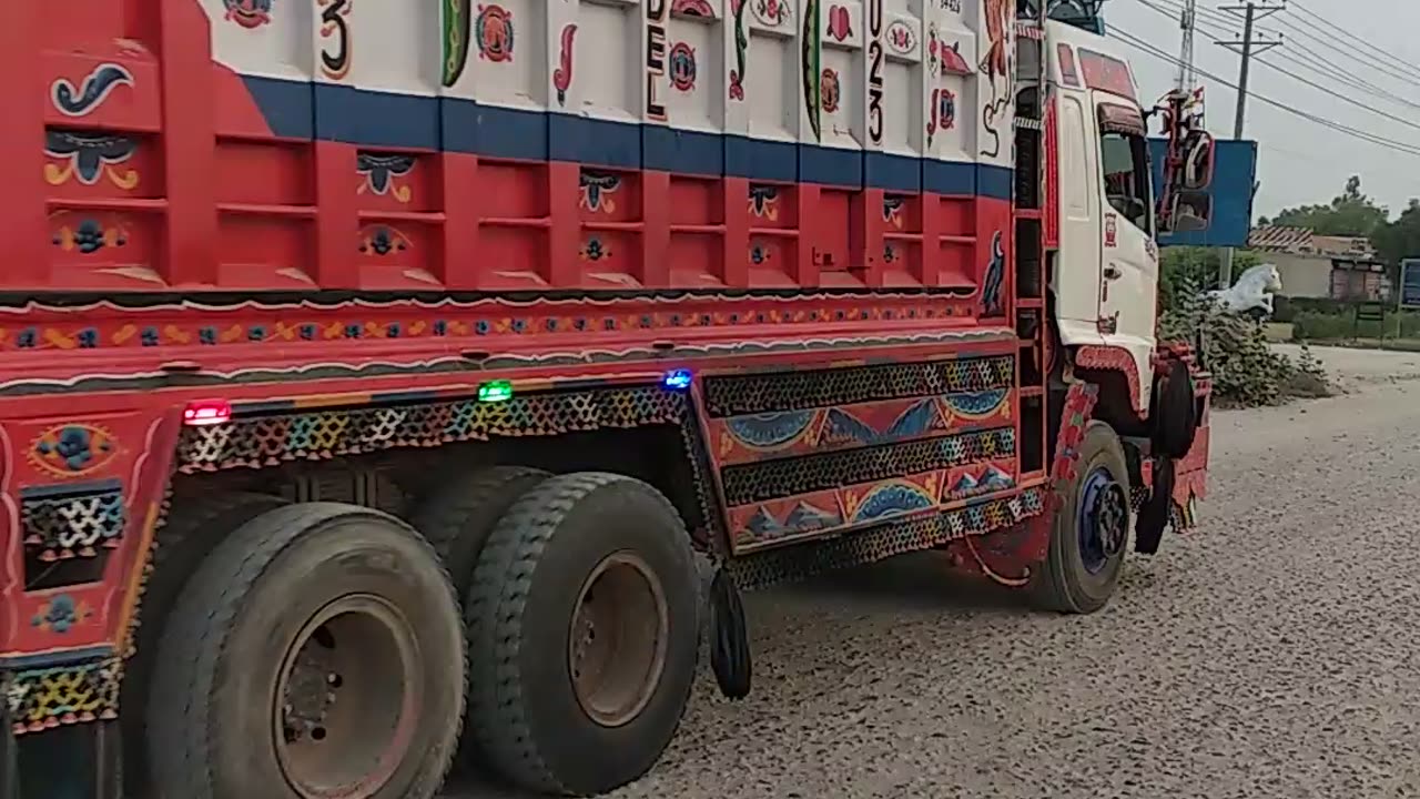 HINO with loaded Pakistani local decorated dumper