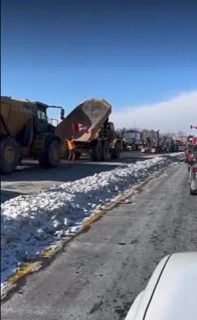 Big mining dump trucks now joining convoy with tractors. WOW. Lets go. People are pissed