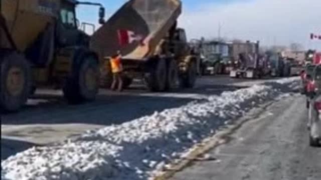 Big mining dump trucks now joining convoy with tractors. WOW. Lets go. People are pissed