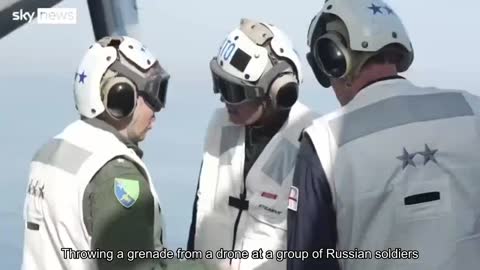 Dropping a grenade from a drone at a group of Russian soldiers by an operator of the 30th mechanize