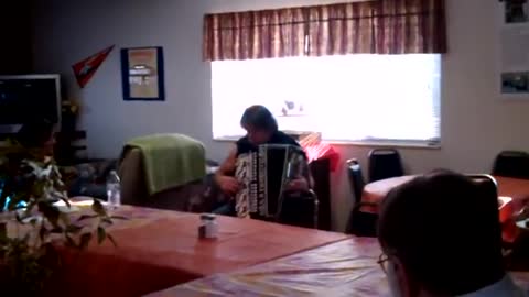 Louis playing the accordion