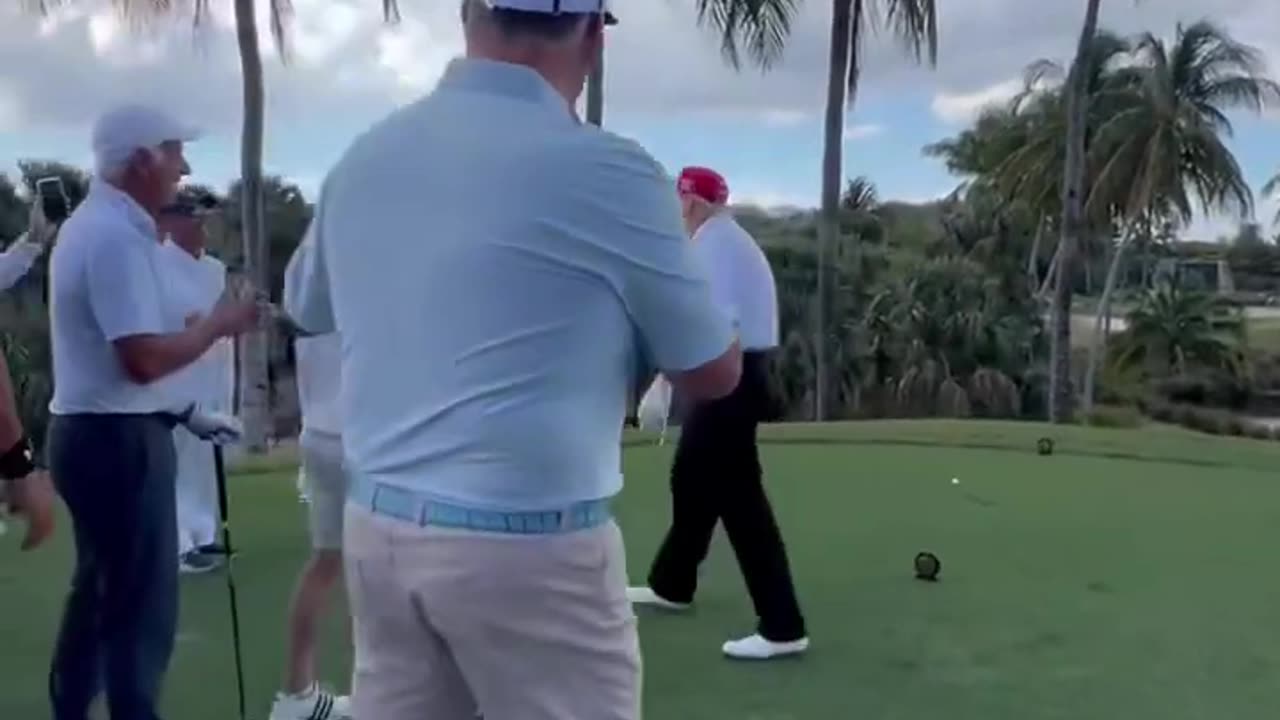 Donald Trump plays golf throws a dart to end the tourney