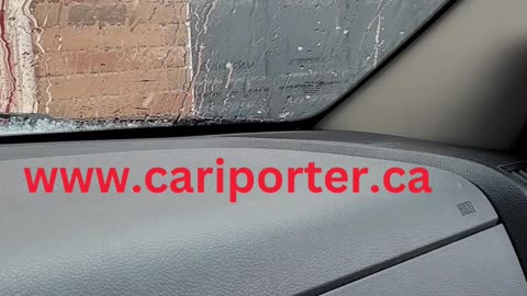 Hail falling on pickup truck in spring weather in Canada