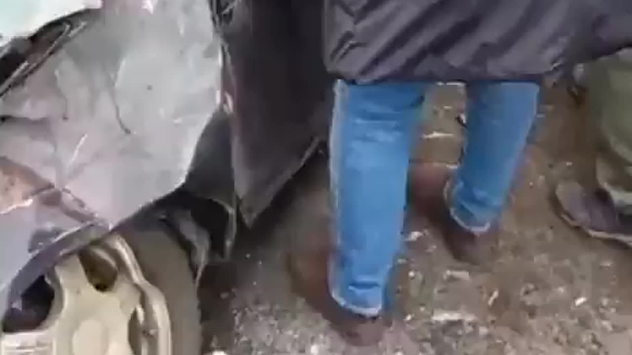 Driver unscathed from his car crushed by a Russian Strela 10