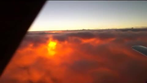 Sun in the clouds from an airplane