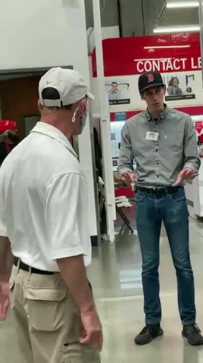 Brainwashed masker shoves and threatens Costco employees with pepper spray because they are not wearing masks.