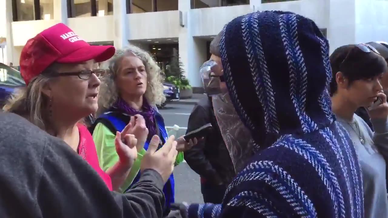 June 4 2017 portland 1.11.2 Lady tells a man with Antifa group to not to touch her