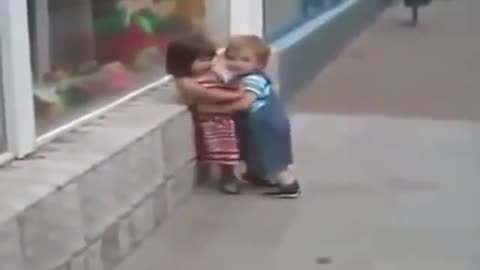 Cute baby, little boy wants to kiss a little girl