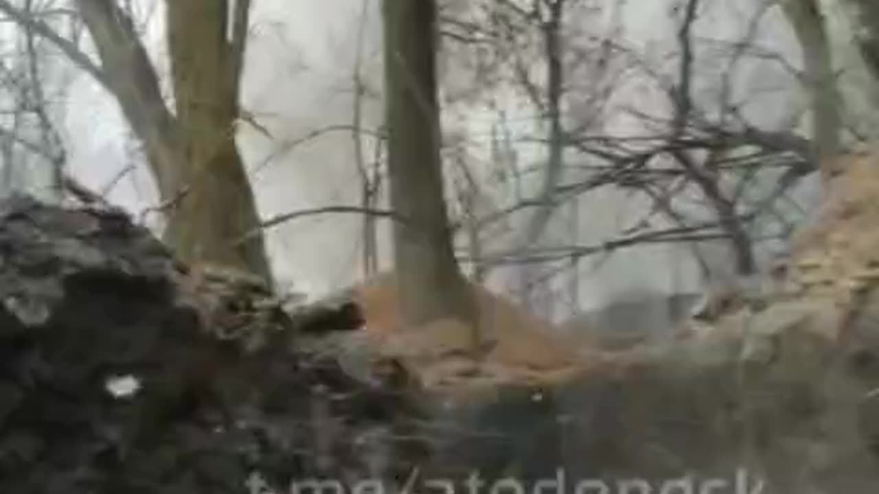 Ammunition burns inside a Ukrainian trench