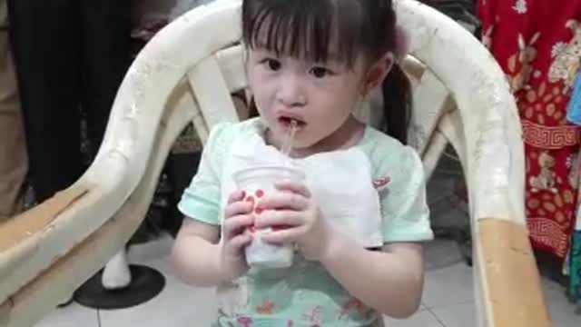 expression of a little girl eating ice cream