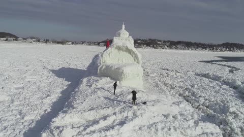 Drone Hovers Around Frozen Boat-Shaped Lighthouse