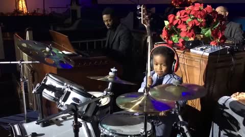 3 yr old LJ playing Little Drummer Boy at church