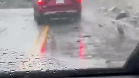 Rocks fall on car at
